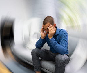 A man holding his head