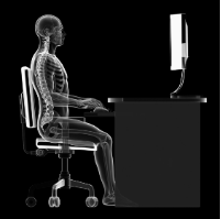 Translucent human sitting at a computer work station