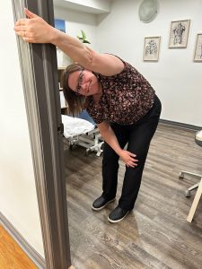 Christine Campbell, Physiotherapist, demonstrating lat stretch