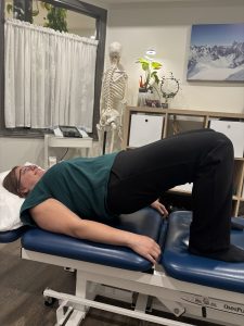 Christine Campbell, Physiotherapist, performing bridge exercise
