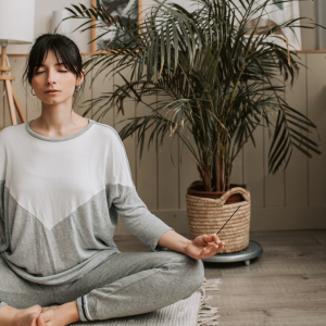 Woman sitting in meditative pose
