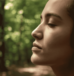 A women, breathing through her nose, outdoors