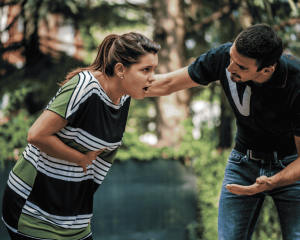 A women gasping for air, someone else trying to help her.